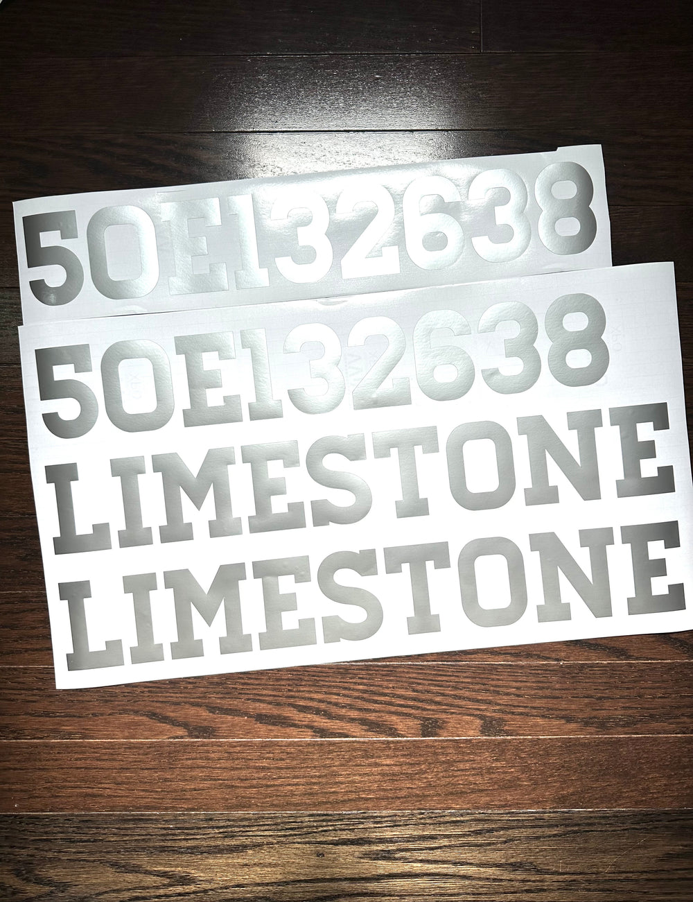 White boat registration numbers and Limestone lettering