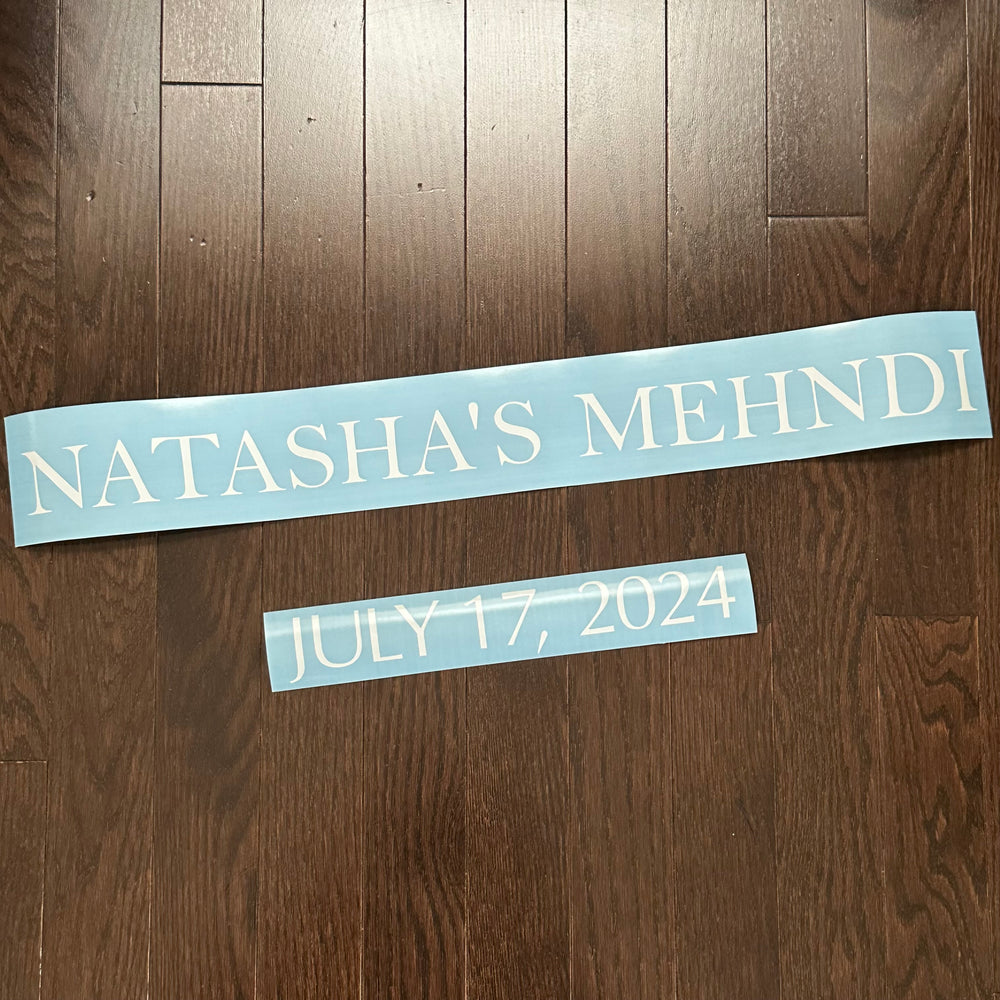 White Natasha’s Mehndi lettering and date laid out on backing