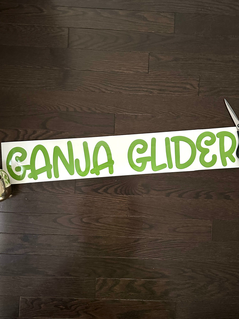 Green Ganja Glider lettering on backing