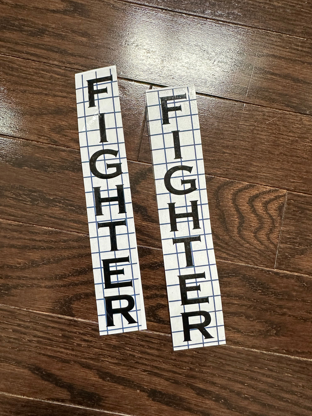 Two black FIGHTER vertical lettering decals with transfer tape