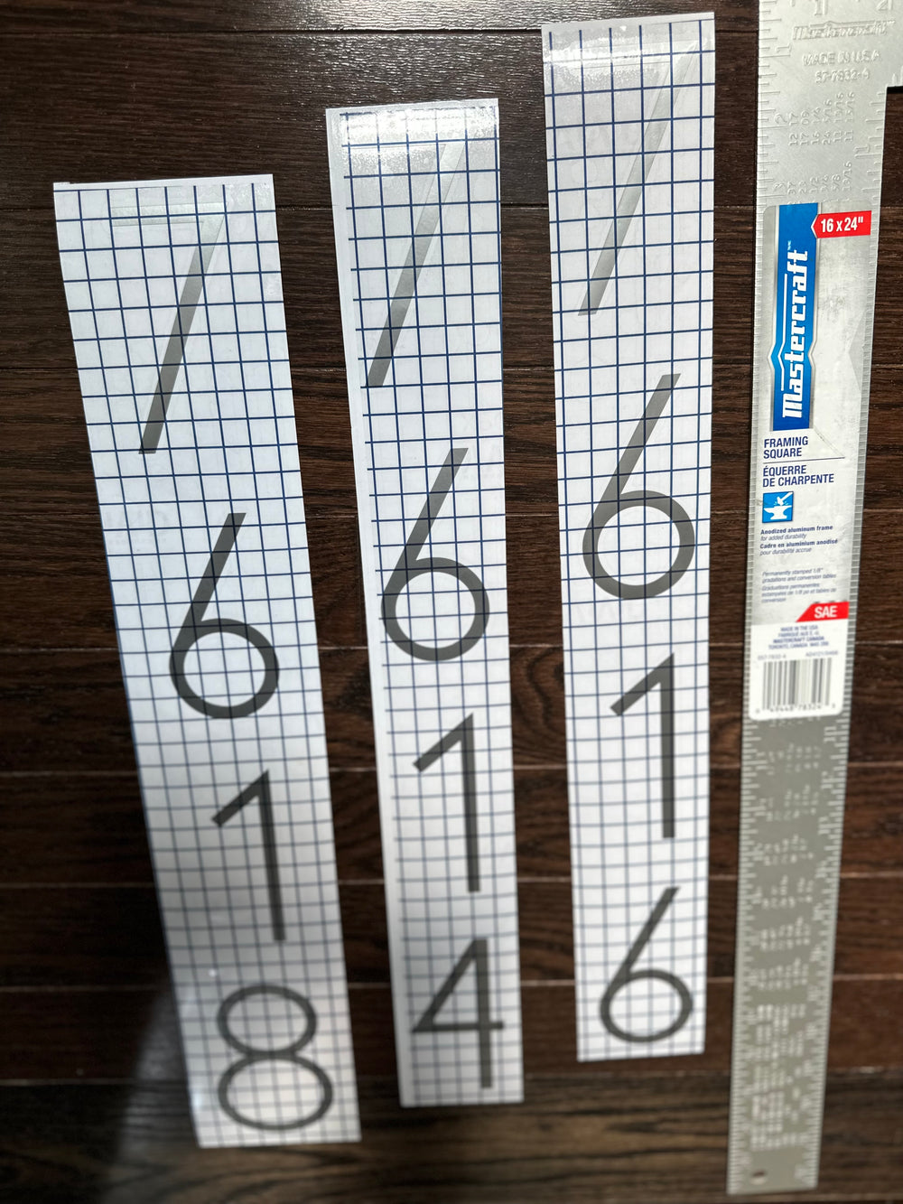 Close-up of vertical number decals with gridded tape