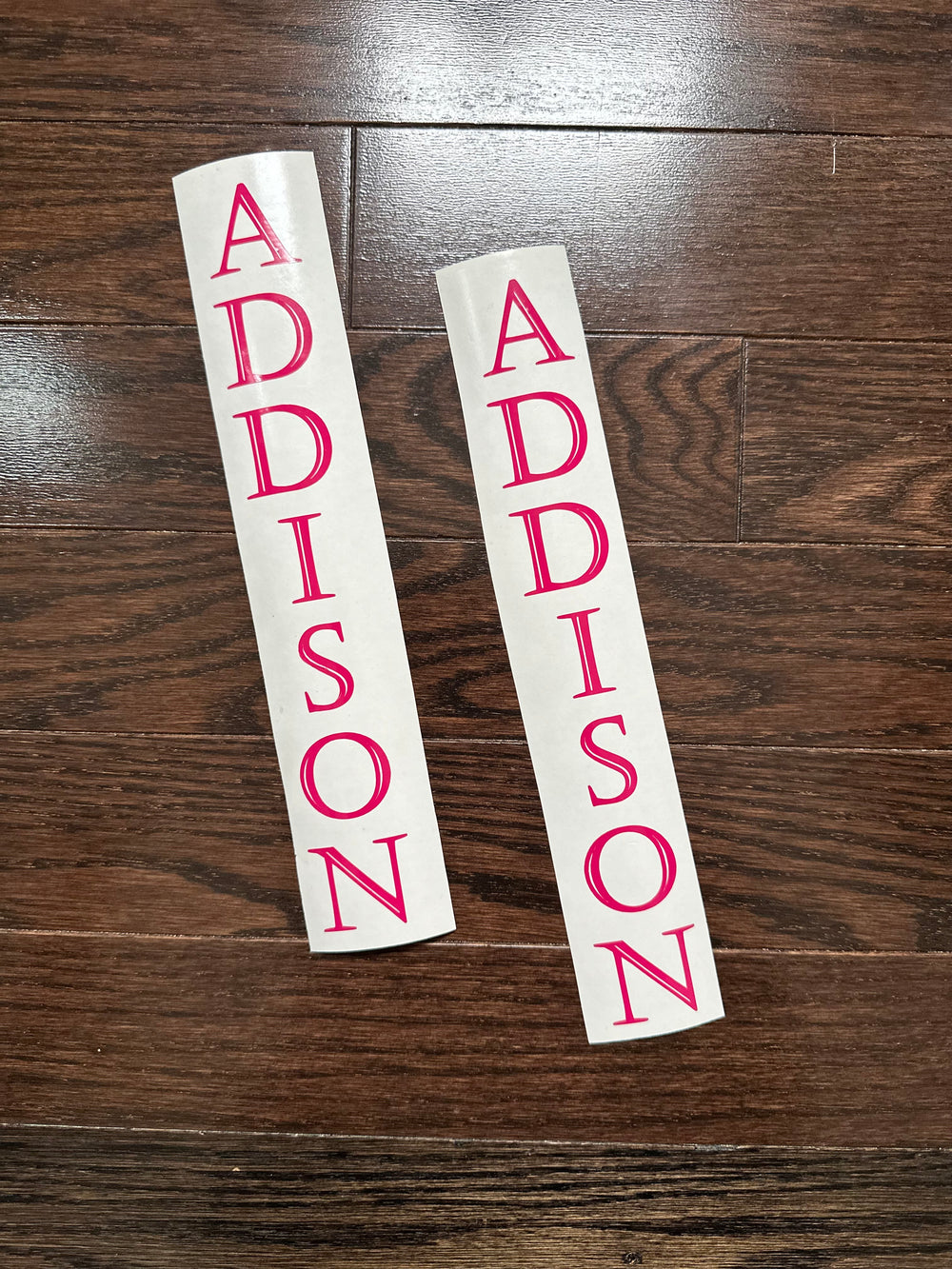 Two pink ADDISON vertical name decals