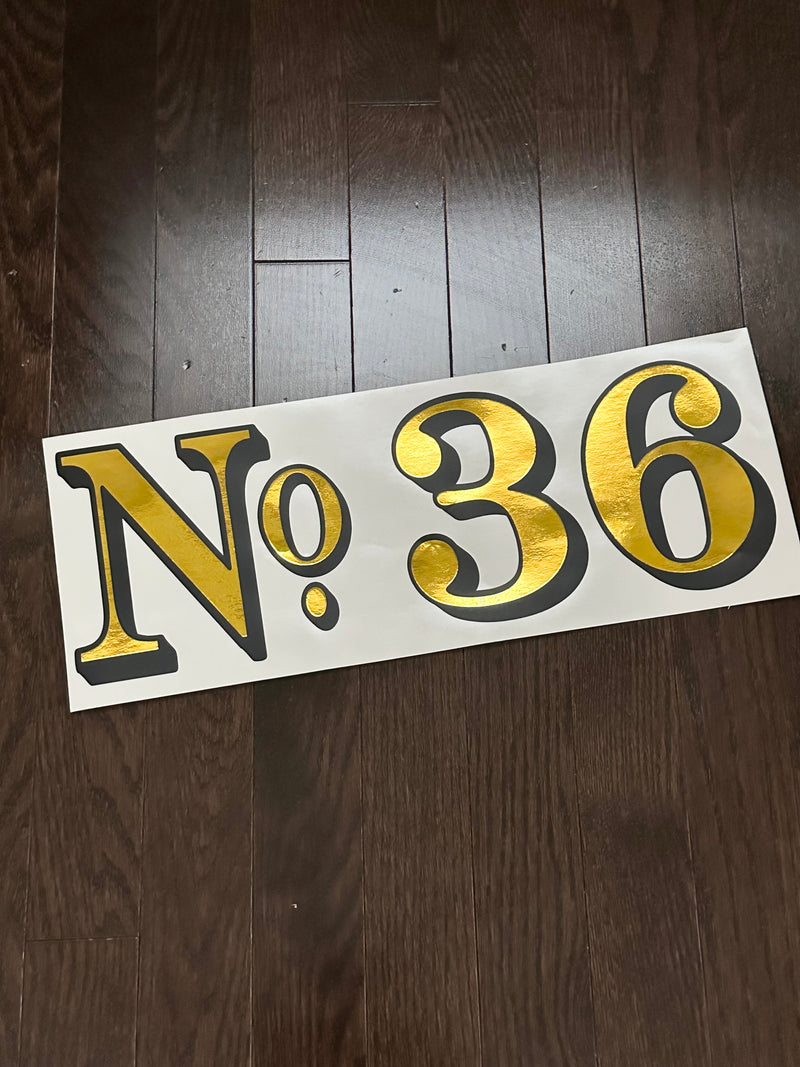 Gold and black No. 36 decal on backing