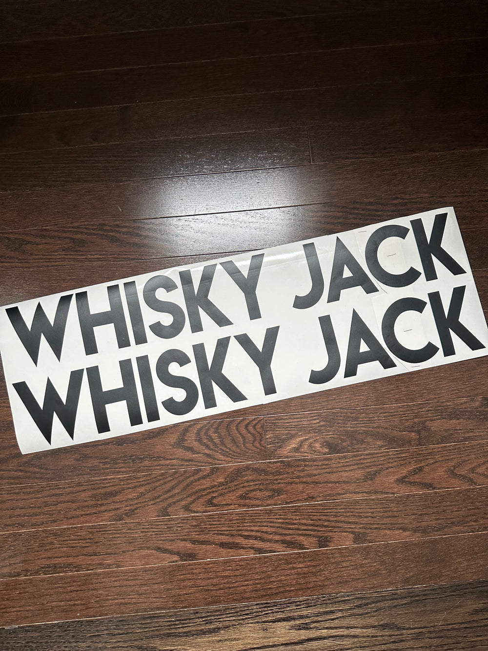 Two grey Whisky Jack boat-name decals
