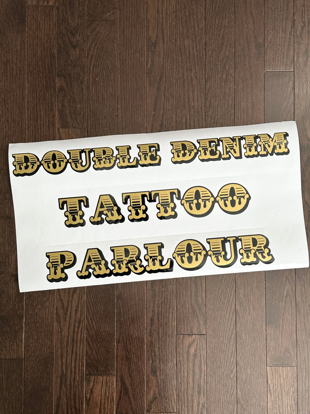 Gold and black Double Denim Tattoo Parlour decal
