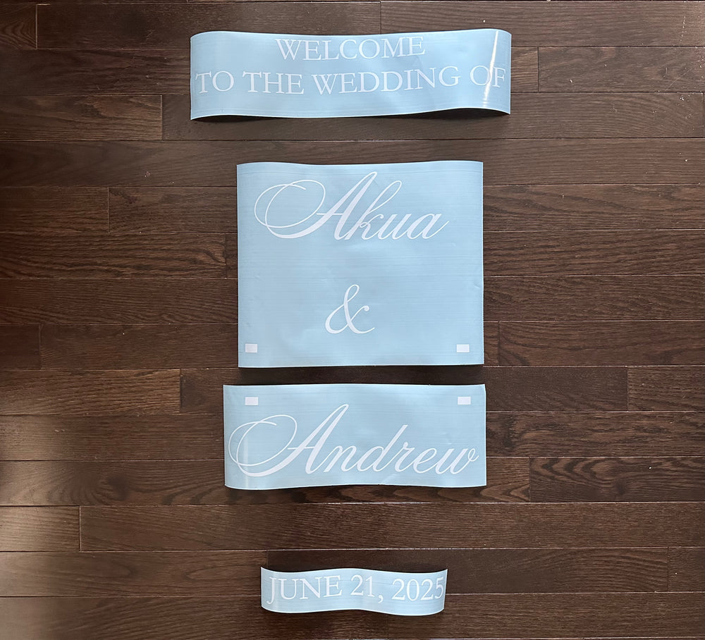 White Alma and Andrew wedding lettering on blue backing sheets