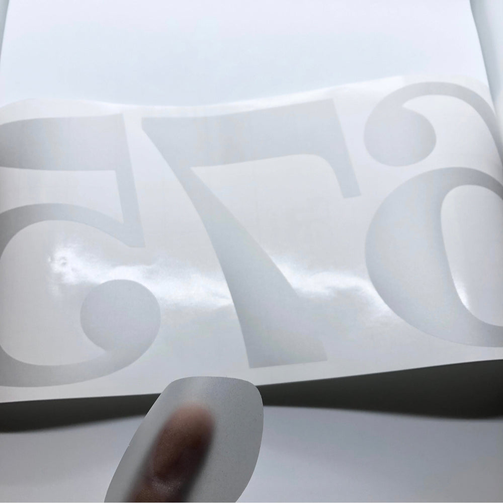 Frosted 54 decal with transfer tape being lifted