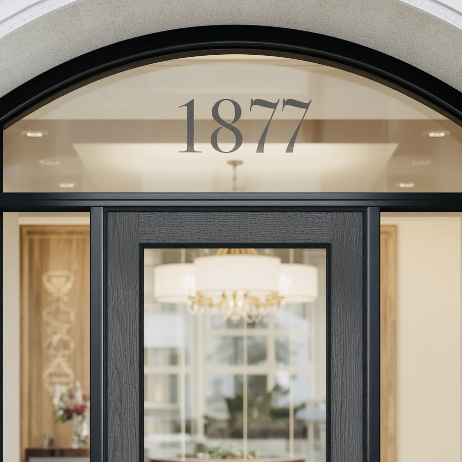 Example arched transom showing 1877 house numbers