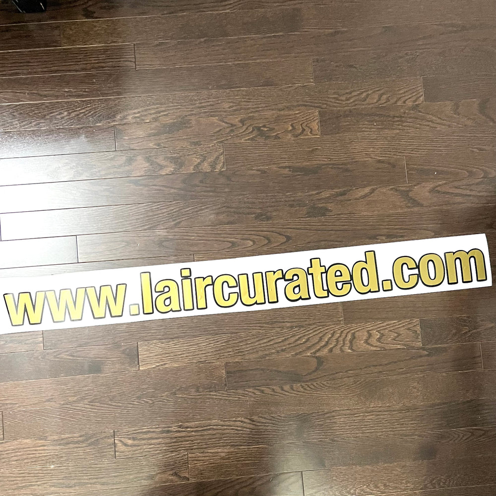 Gold and black website address lettering