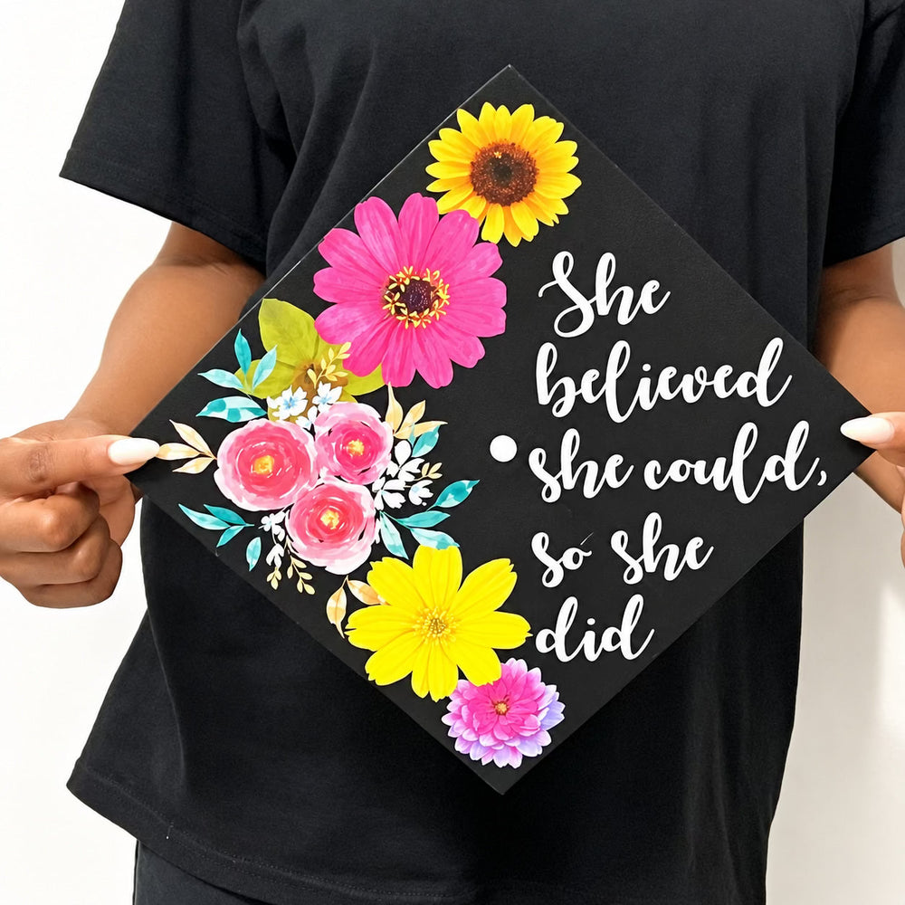 Graduation cap decorated with white inspirational lettering and colourful flowers