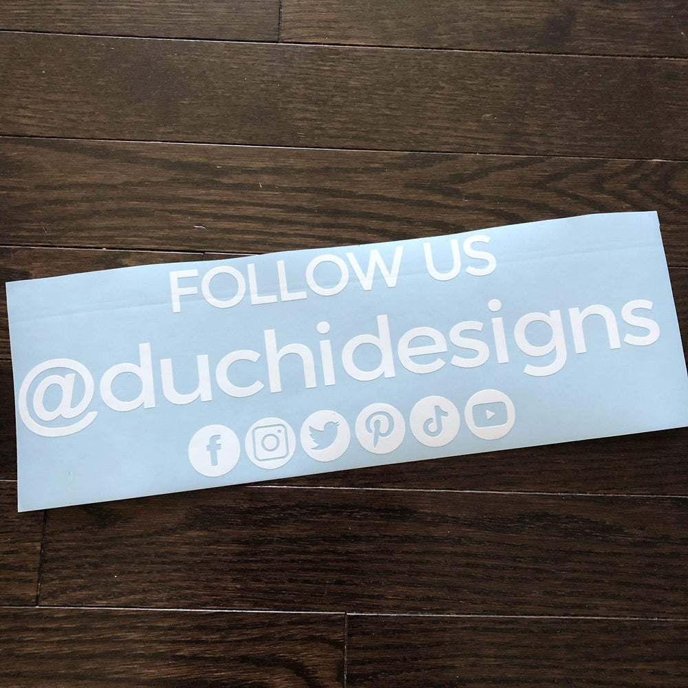 White Follow Us @duchidesigns lettering on blue backing