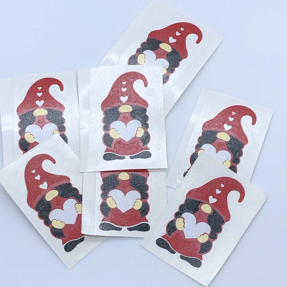 Red-hatted gnome decal examples on separate backing sheets