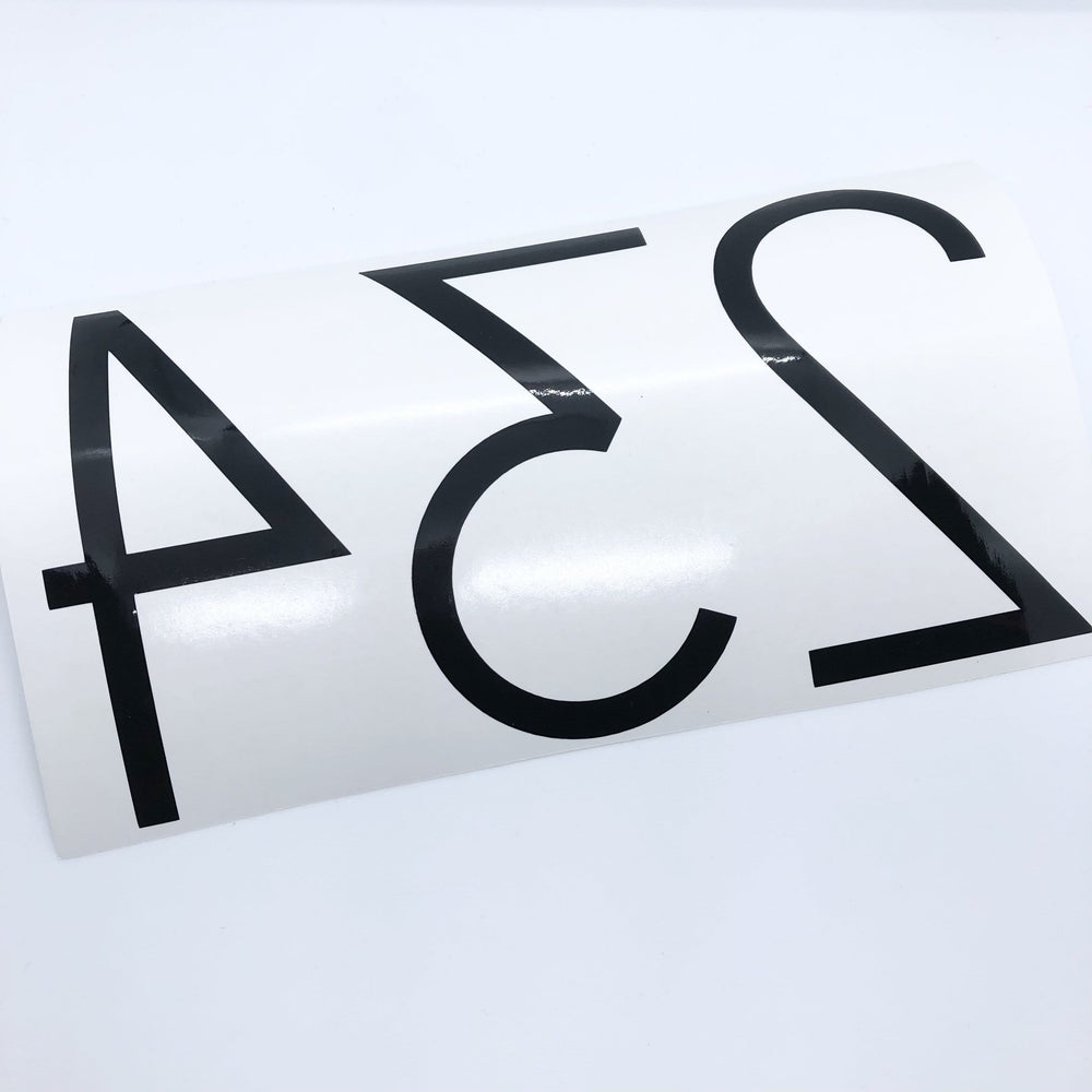 Reverse-oriented black 234 digits on backing