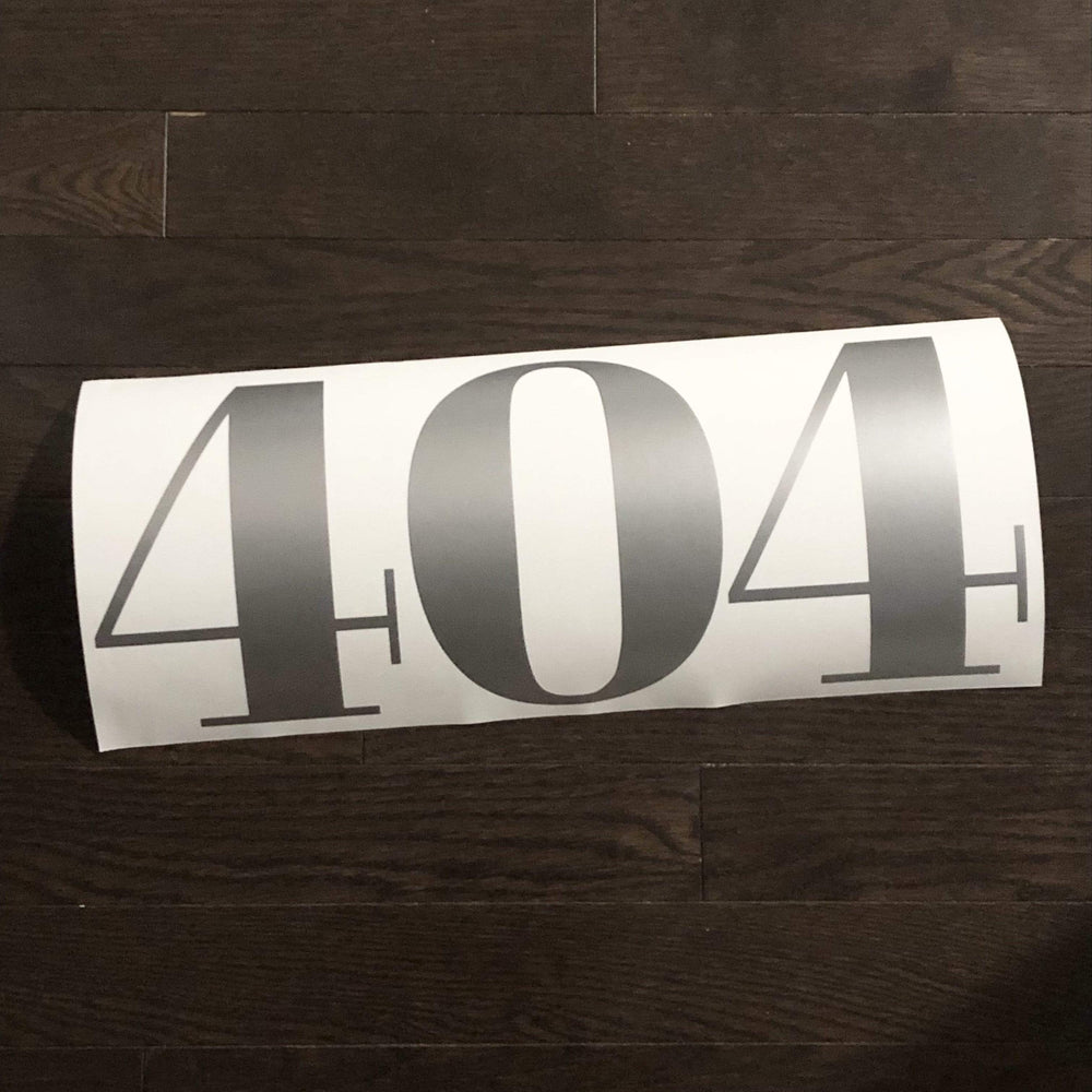 Grey-coloured 404 number decal on white backing