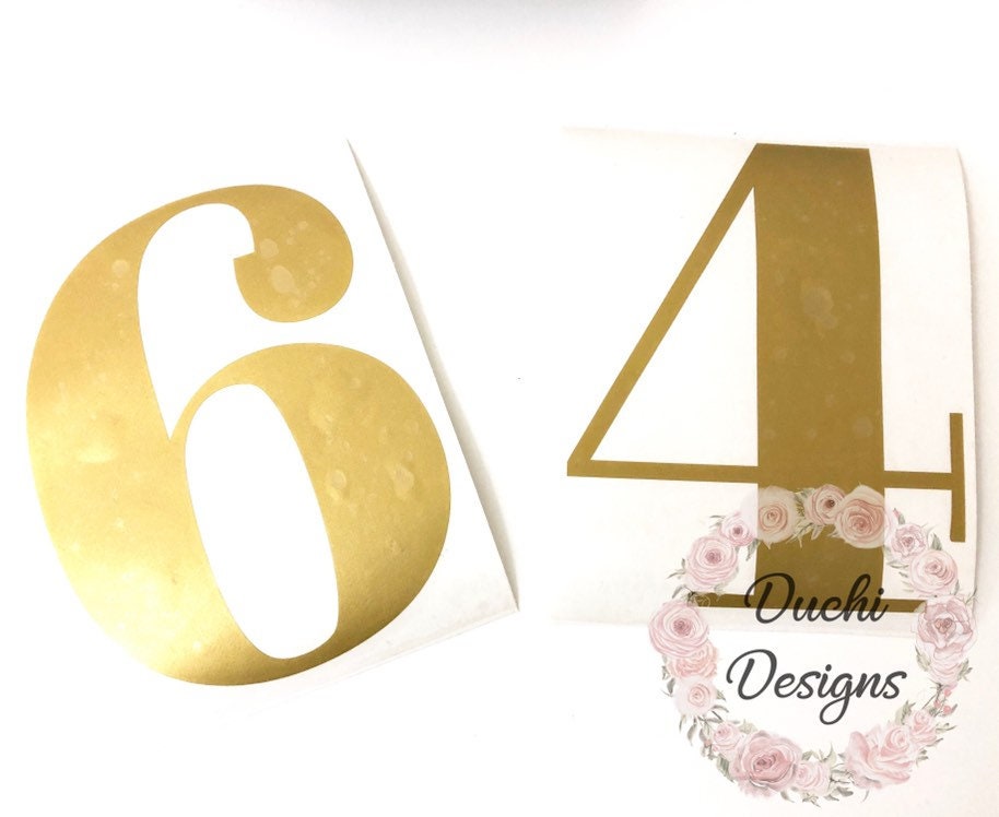 Gold-coloured 64 number decal on backing