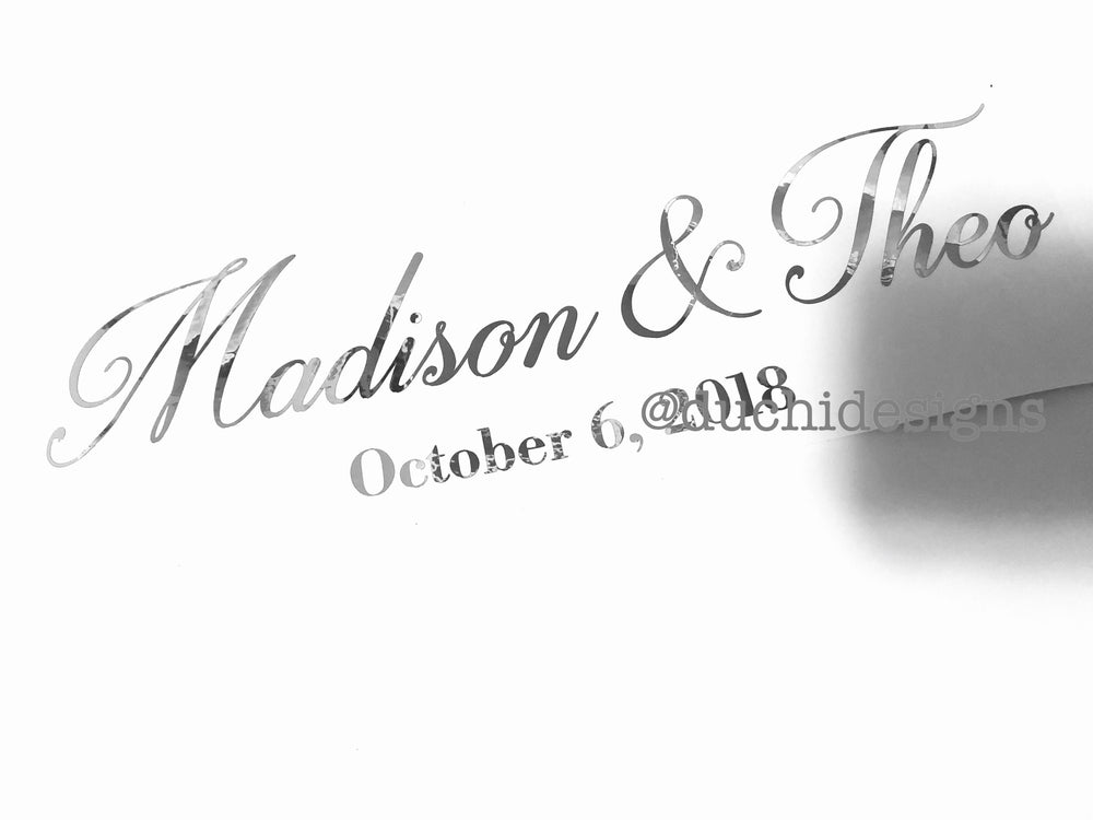 Silver-coloured Madison & Theo names and wedding date