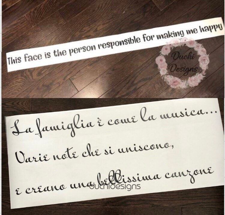 Two custom quote decals laid out on backing