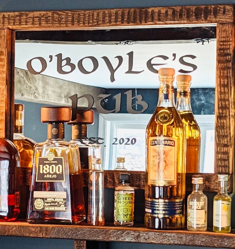 O’Boyle’s pub lettering on a mirror behind bottles