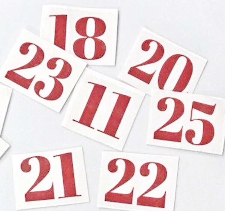 Red two-digit number decals on separate backing sheets