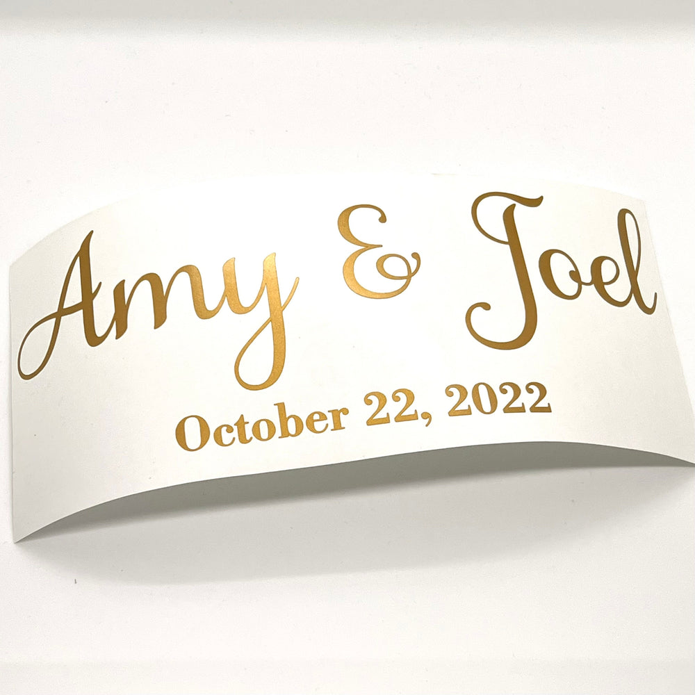 Gold-coloured Amy & Joel names and wedding date decal