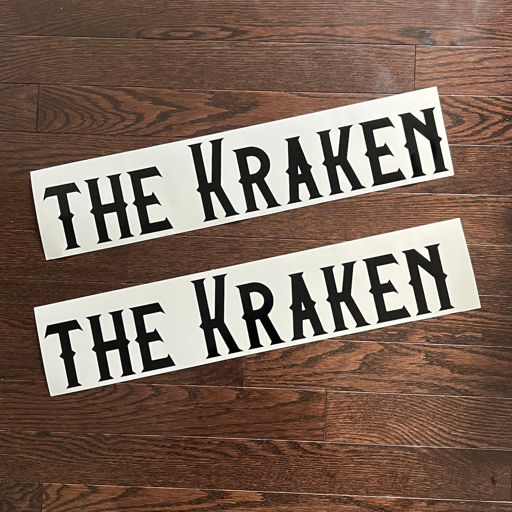 Two black The Kraken boat name decals