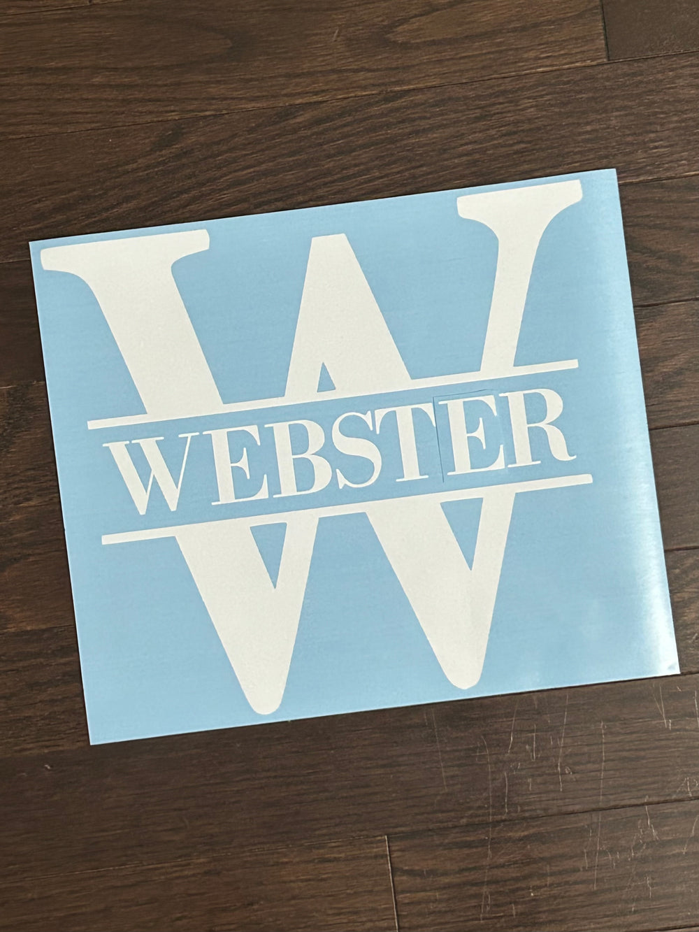 White Webster split monogram on blue backing