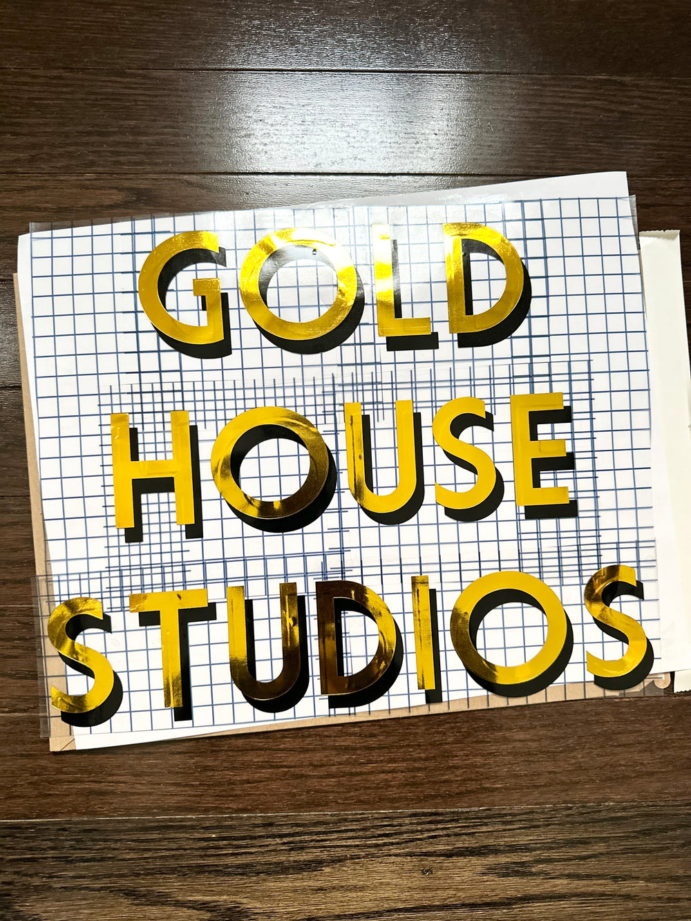 Gold House Studios layered decal on gridded transfer tape