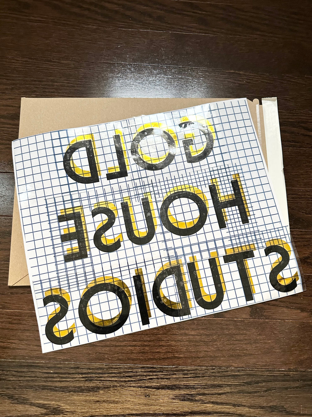 Reverse-oriented Gold House Studios layered decal
