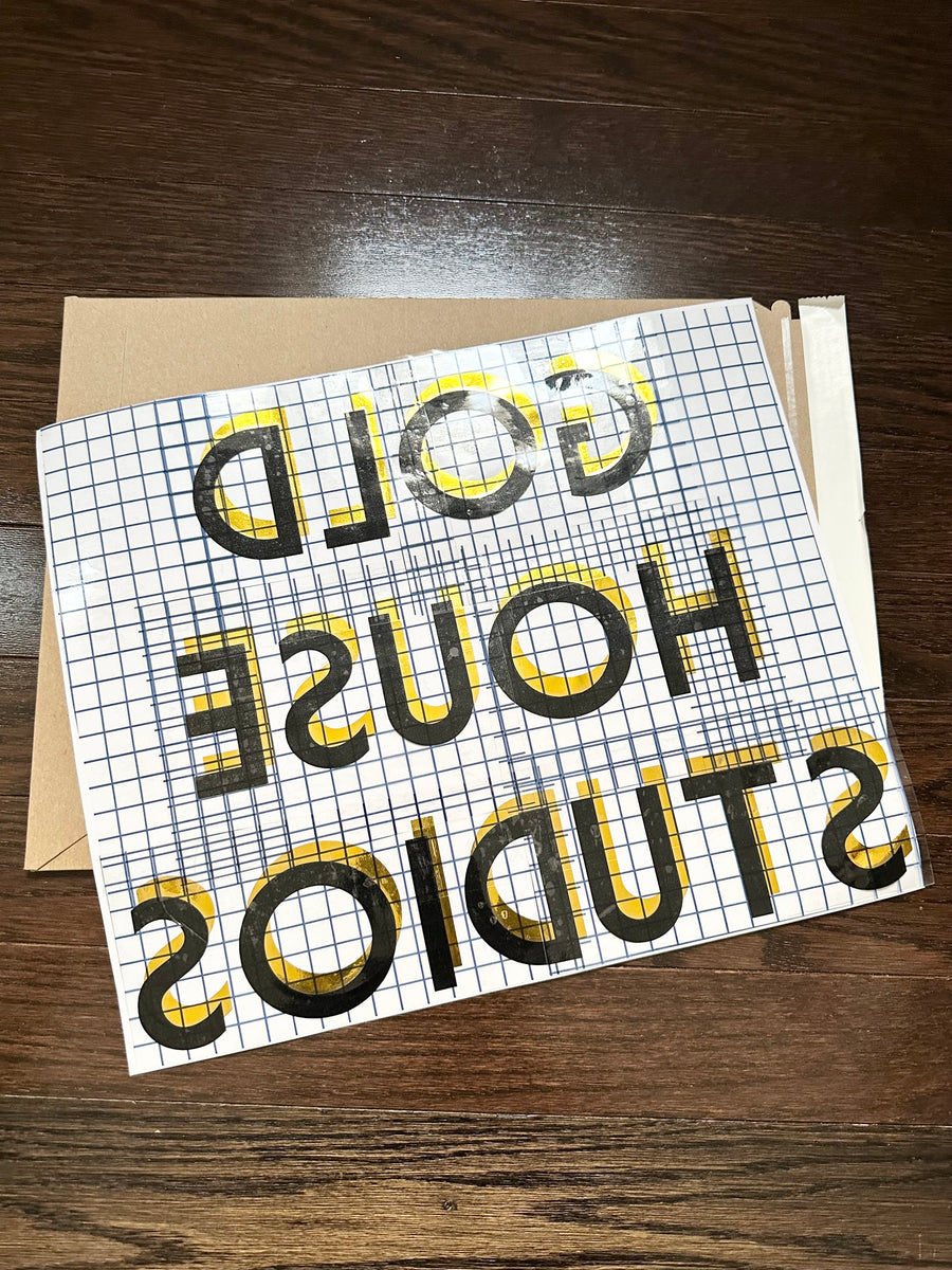 Reverse-oriented Gold House Studios layered decal