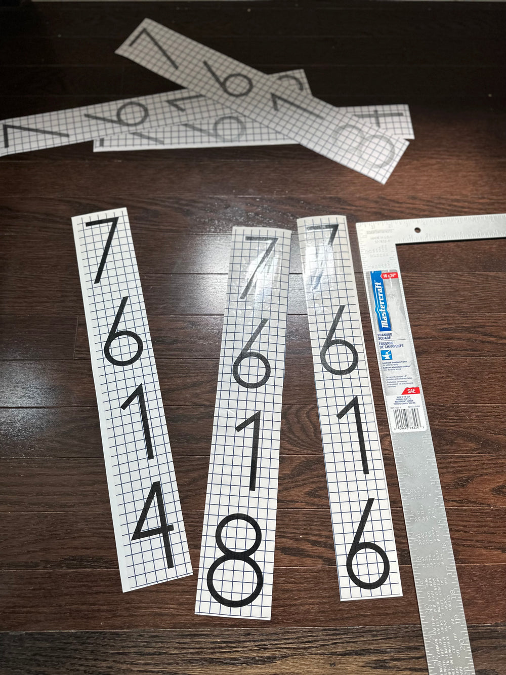 Several vertical number strips laid out with transfer tape