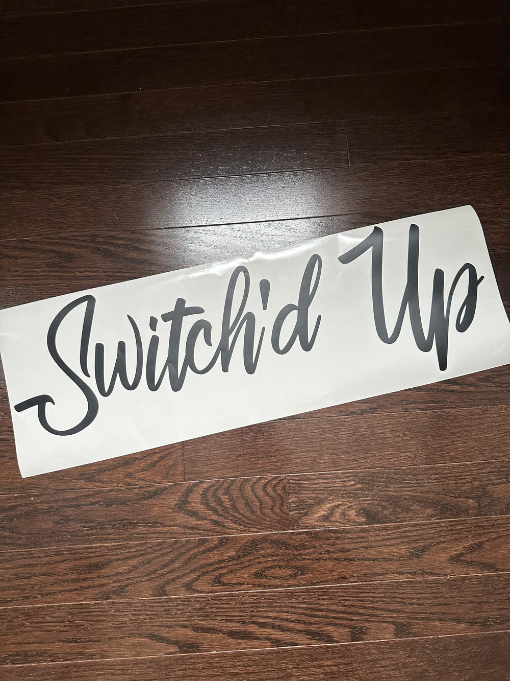 Grey Switch’d Up script lettering on backing