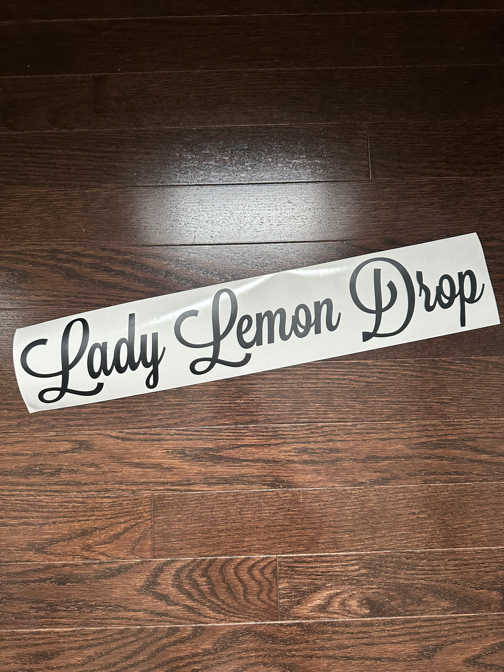 Grey Lady Lemon Drop script lettering on backing