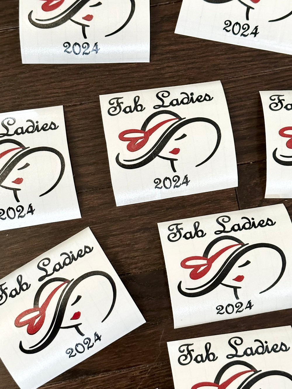 Multiple Fab Ladies 2024 logo decals on backing