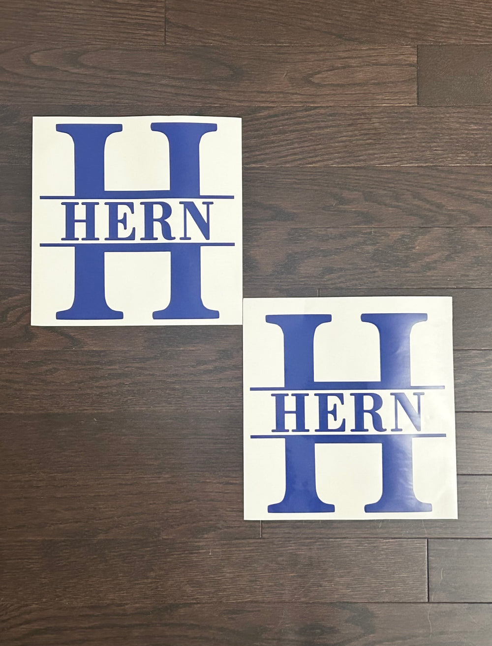 Two blue Hern split-monogram decals