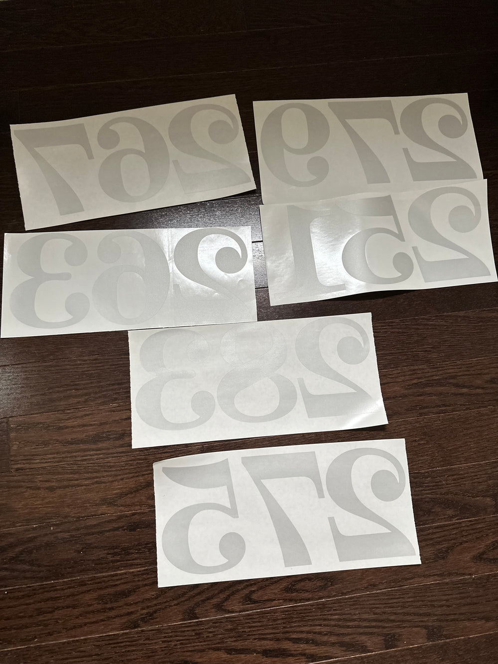 Assorted frosted number decals on backing sheets