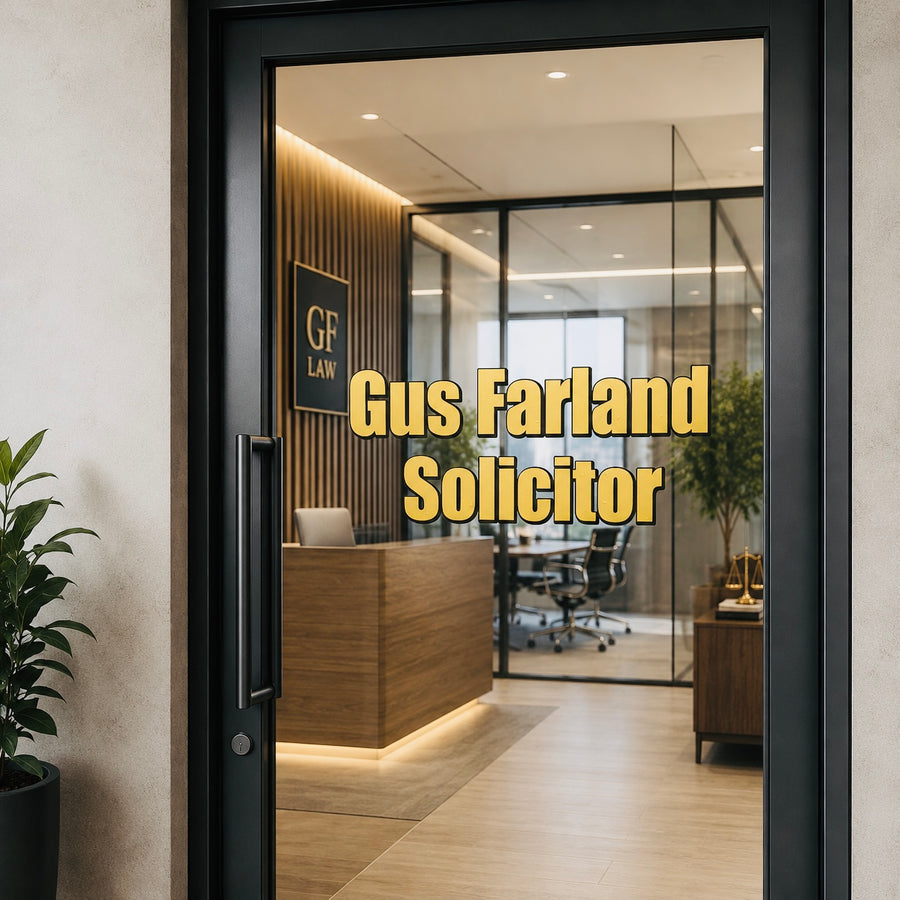 Example office glass with gold Gus Farland Solicitor lettering