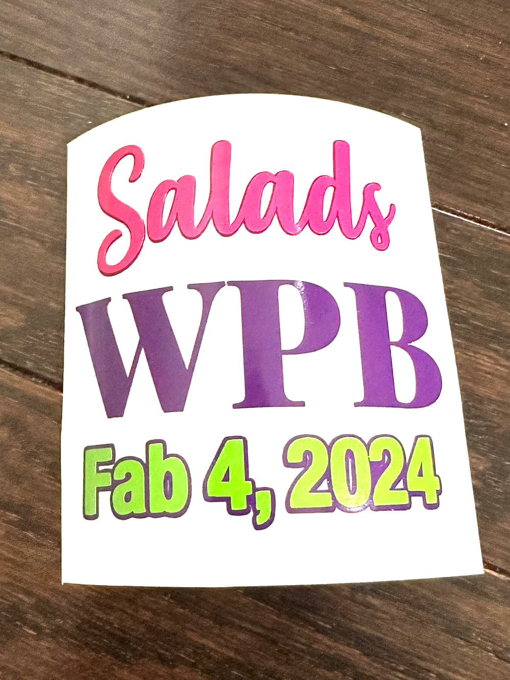 Pink, purple and green Salads WPB event decal on backing