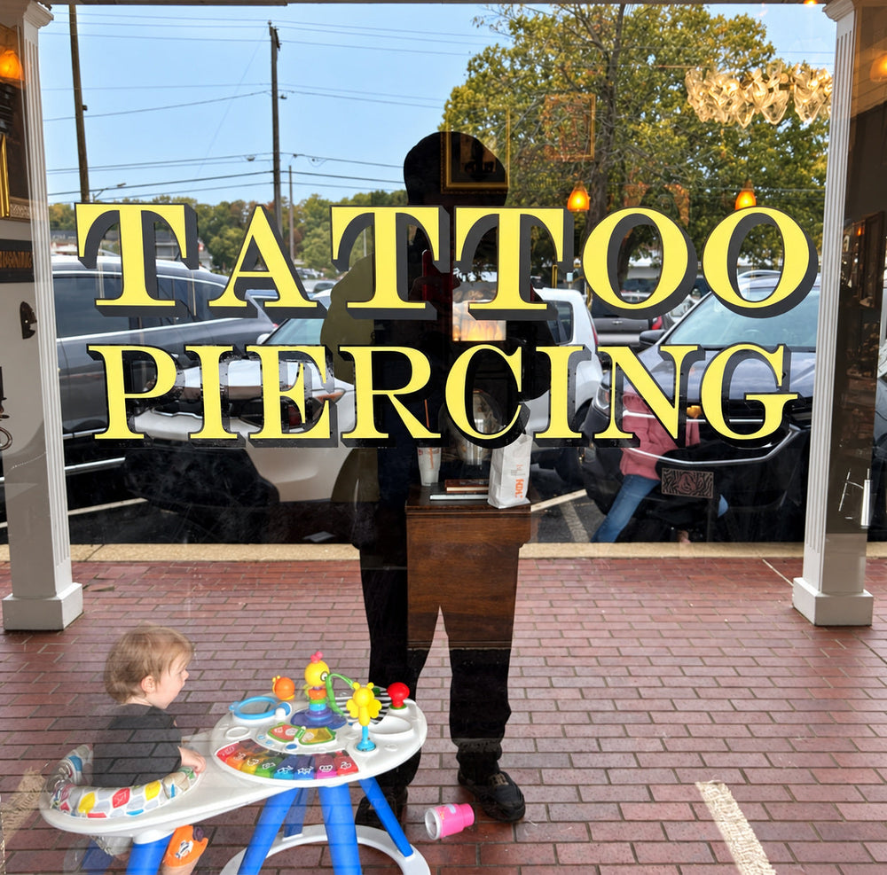 Gold and black Tattoo Piercing window lettering