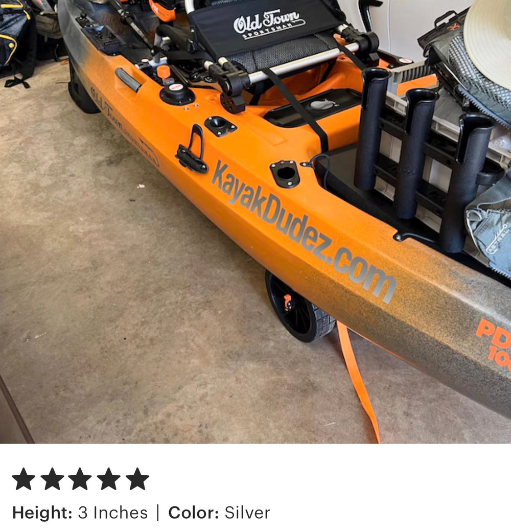 Navy Blue lettering on an orange kayak with fishing equipment