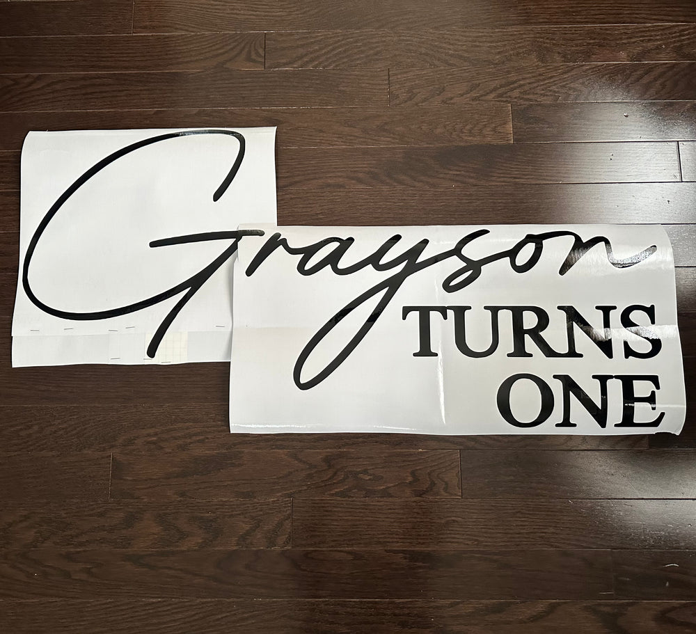 Black Grayson Turns One lettering on backing sheets