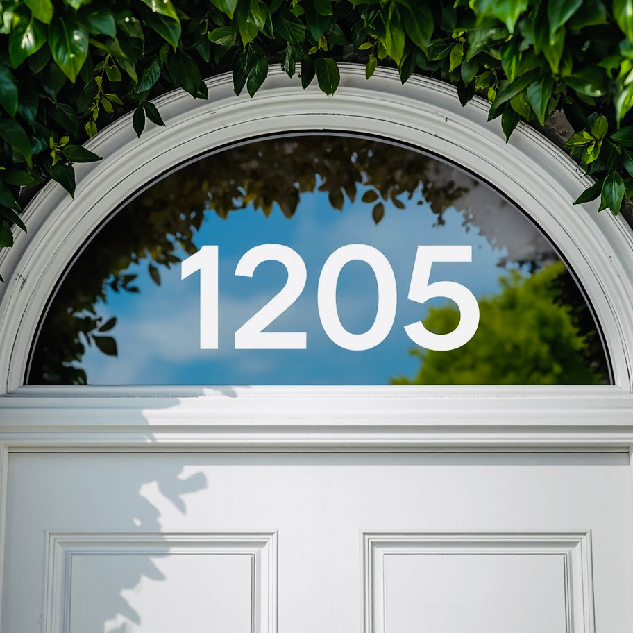 Example arched transom with white 1205 house numbers
