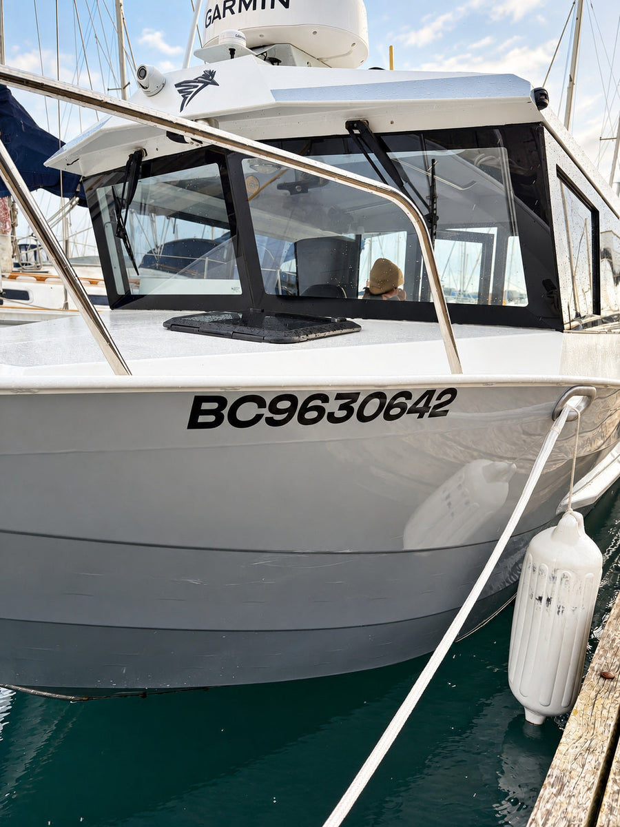 Black BC9630642 registration numbers on a boat hull