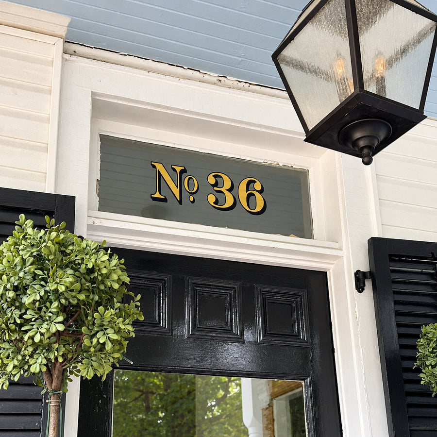 Example of gold and black No 36 transom address lettering
