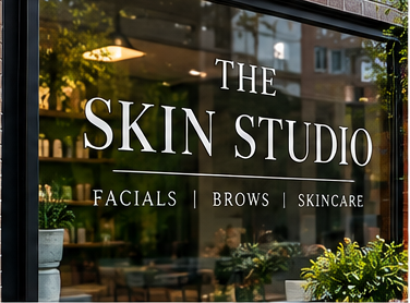 Example of The Skin Studio business lettering on storefront glass
