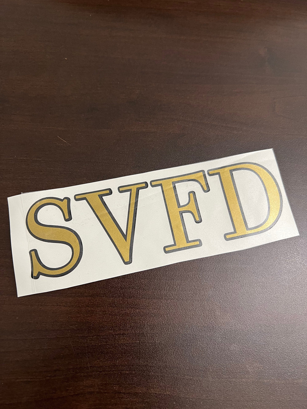 Gold and black SVFD lettering