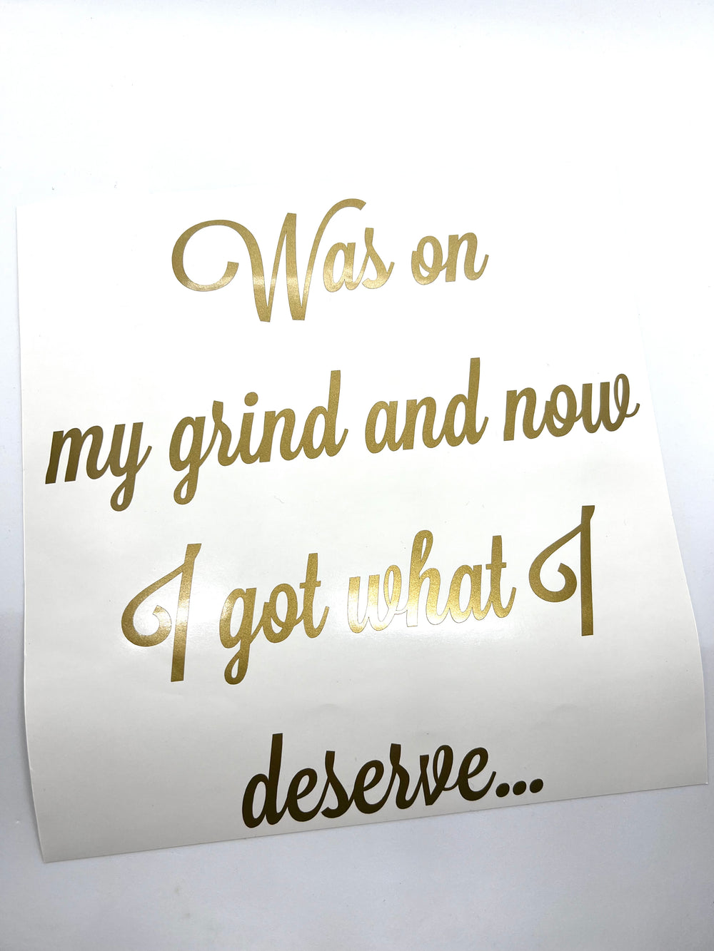 Gold and black Was on my grind quote lettering on backing