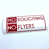 Red No Soliciting No Flyers decal on curved backing