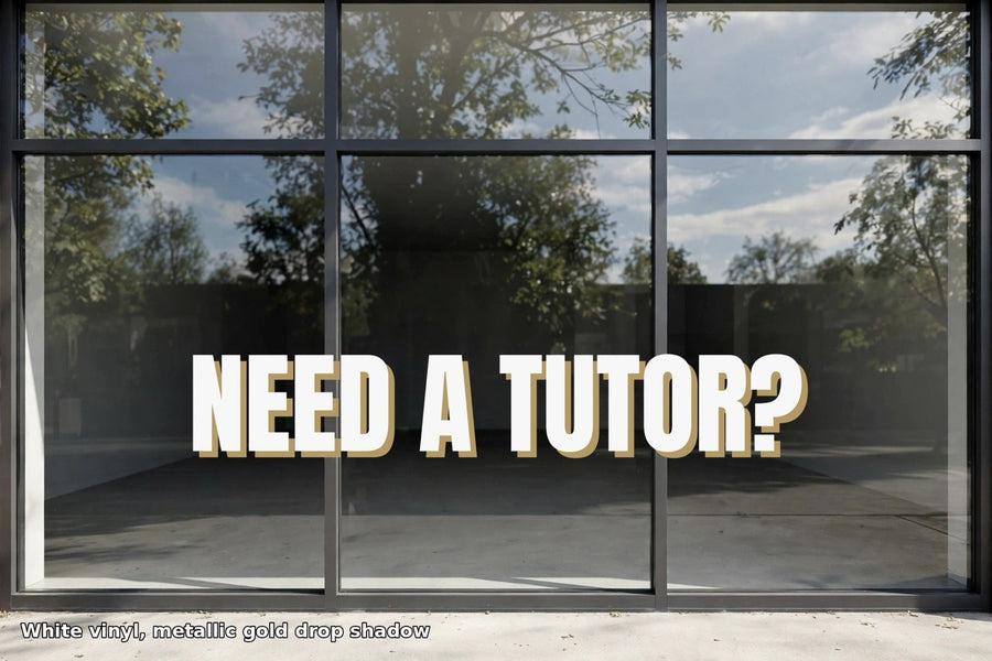 White vinyl NEED A TUTOR? lettering with metallic gold drop shadow on storefront window