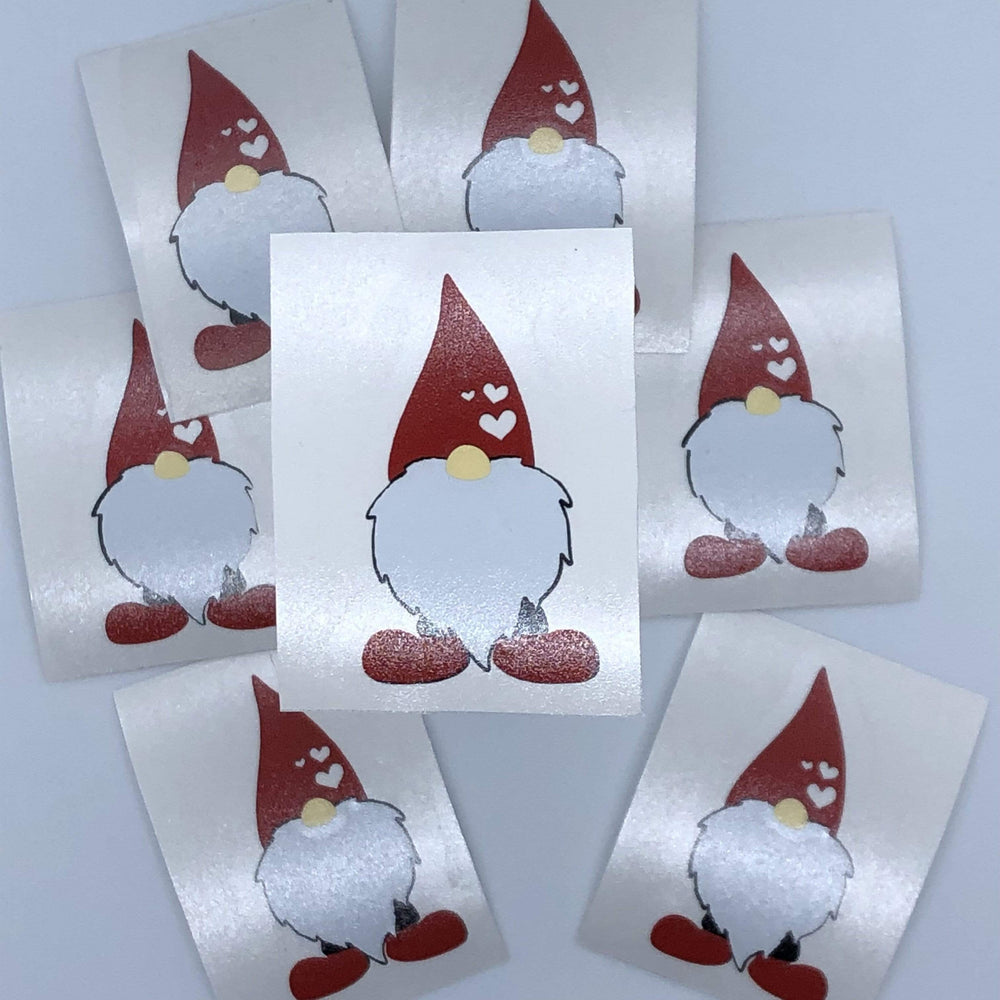 Several decorative gnome decal examples on backing