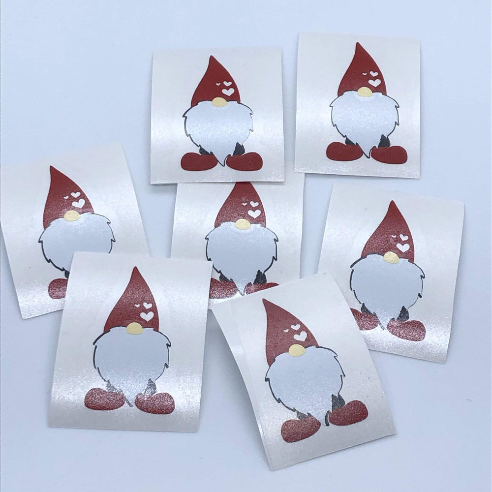 Several white-bearded gnome decal examples on backing